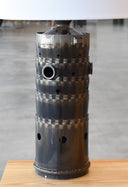 Combustion liner with dark burnishing from heat in the engine