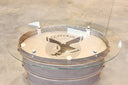 Accent table made from tailpipe assembly of a convair aircraft. Convair logo under oval glass top. Burnished bronze patina with polished steel rings. 17.5" high